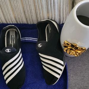 Black and white striped Champion tennis shoes.